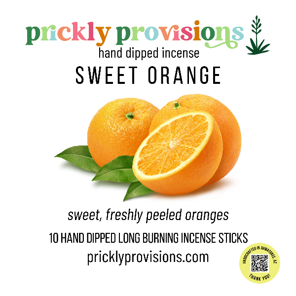 Promotional image for Prickly Provisions Sweet Orange incense with oranges and leaves on a white background.