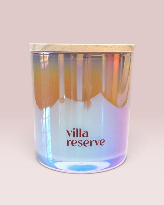 Villa Reserve 12 oz wood-wick candle in iridescent blush glass
