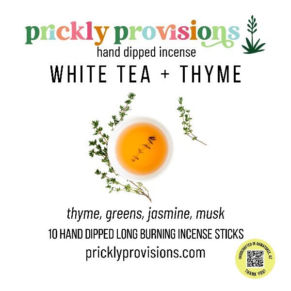 Promotional image for prickly provisions white tea and thyme incense with a teacup and thyme sprigs.